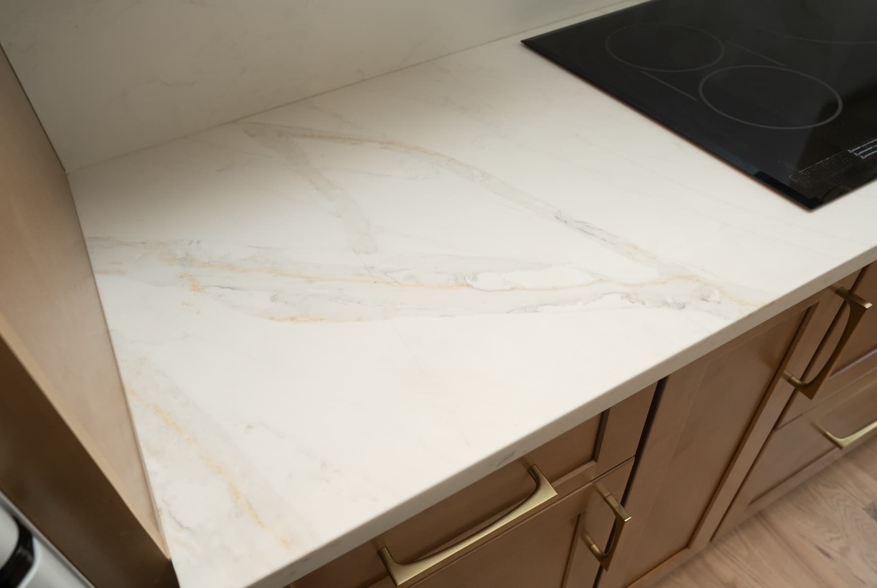 Close view of gold veining on a Calacatta Silverlight countertop corner