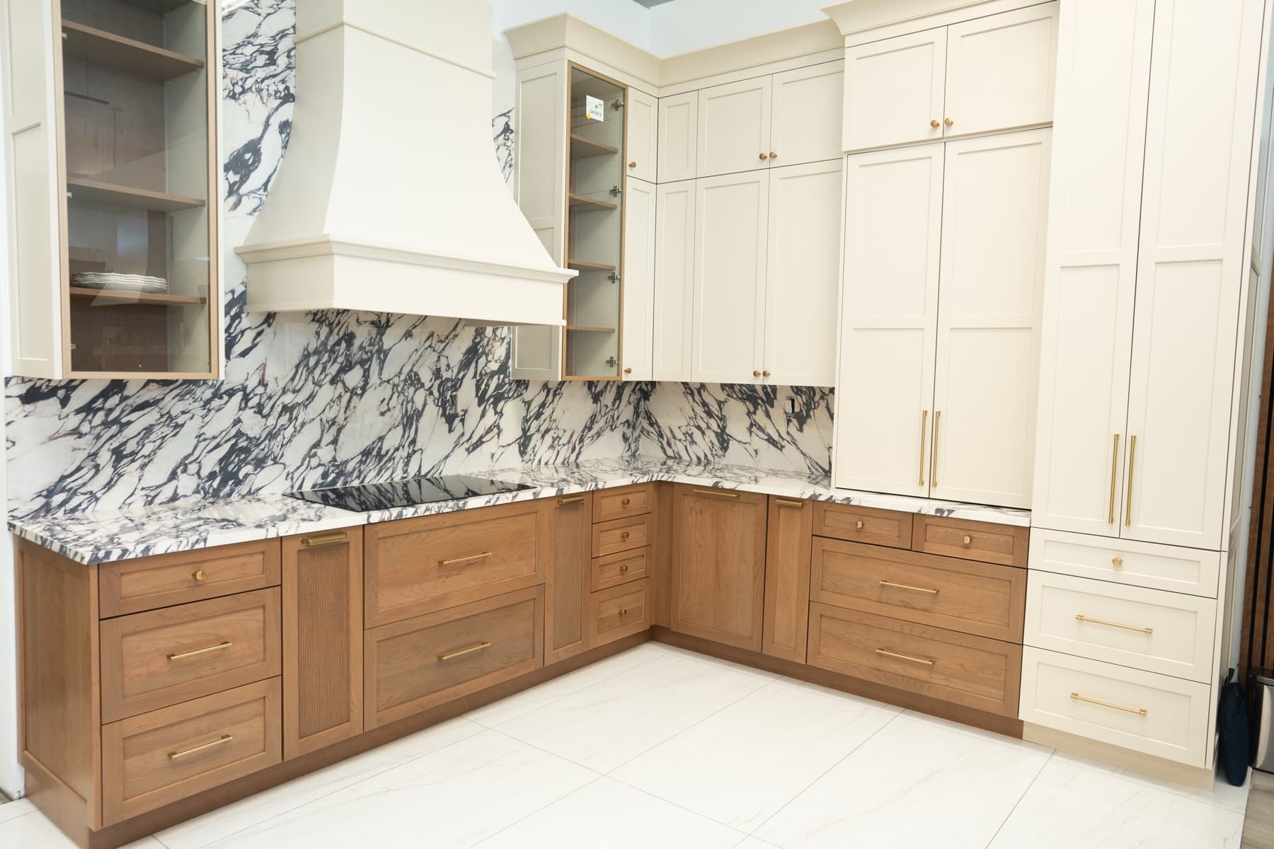 Kitchen with dramatic violet-veined Calacatta Viola porcelain countertops and full-height backsplash